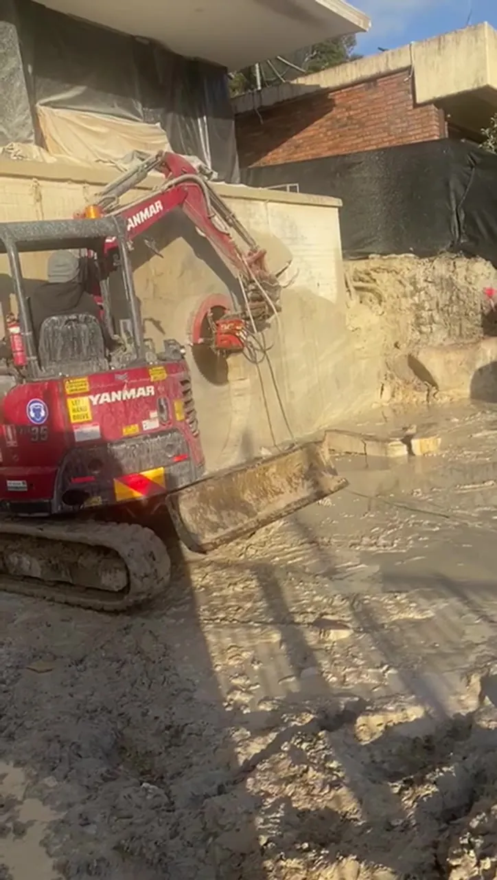 Rock saw cutting the sandstone face