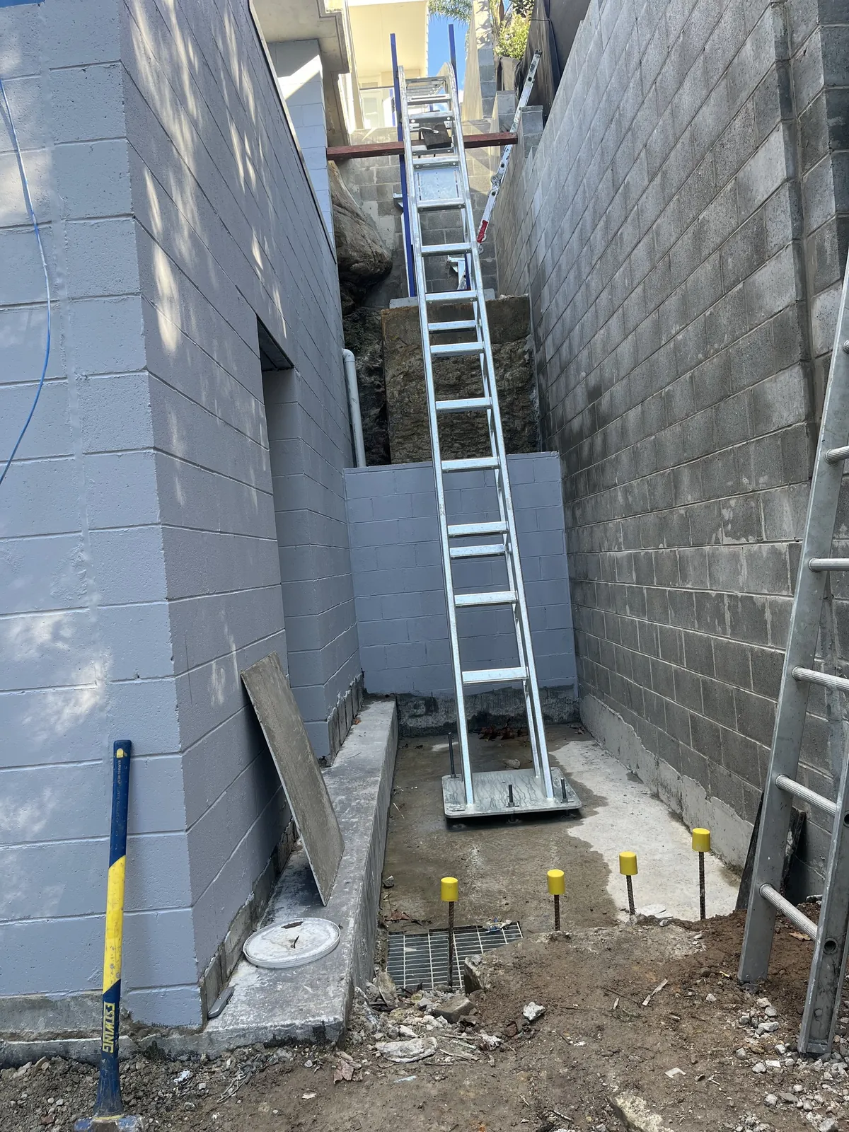 Inclinator lift rail beside the garage