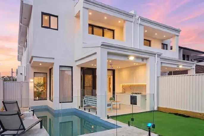 Rear pool and alfresco at dusk, Padstow duplex